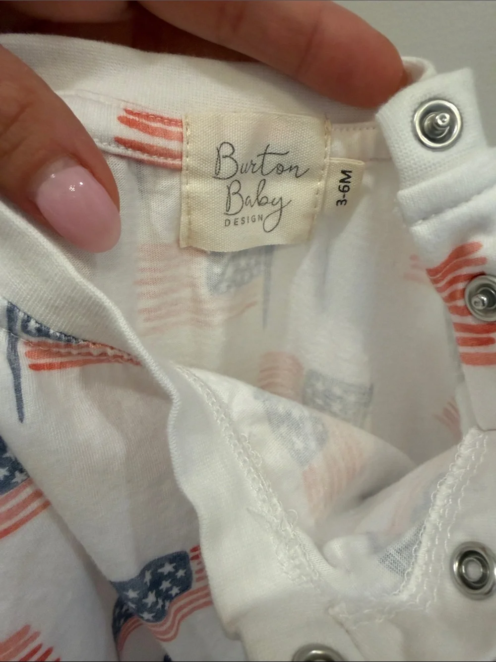Burton White Baby One-Piece with Red & Blue Flag Print